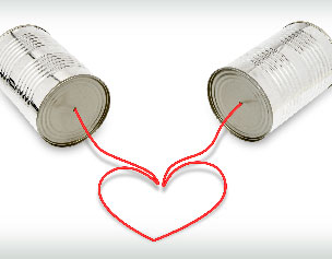 tin can telephone with string forming a heart