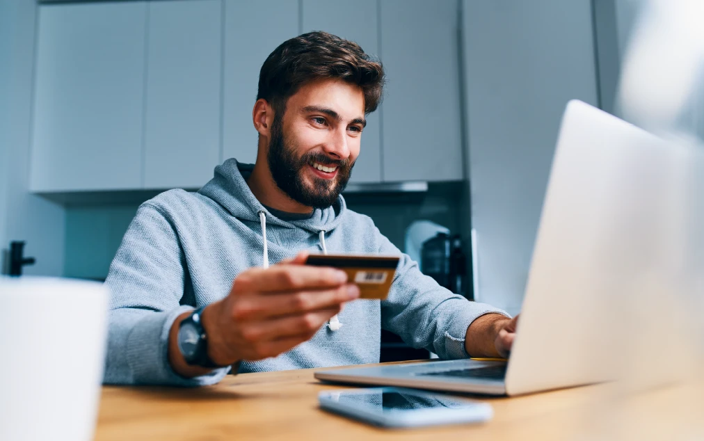 Customer entering their credit card number on a computer