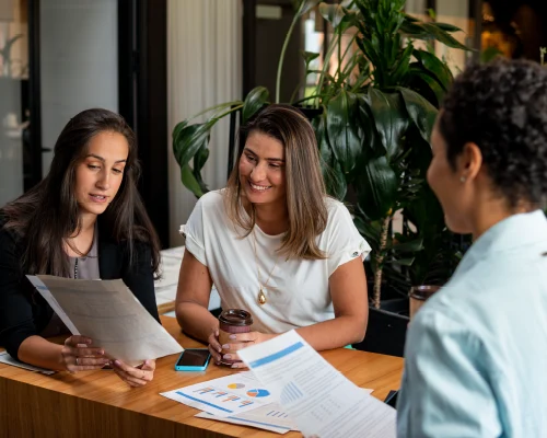 A team collaborating around a desk