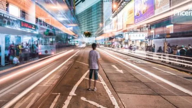 A man in the middle of a busy street