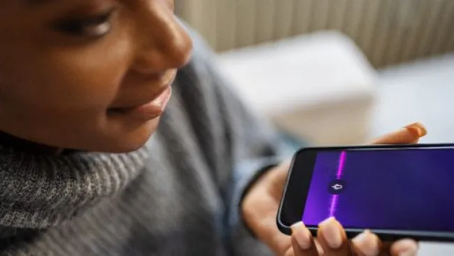 A woman recording a voice message