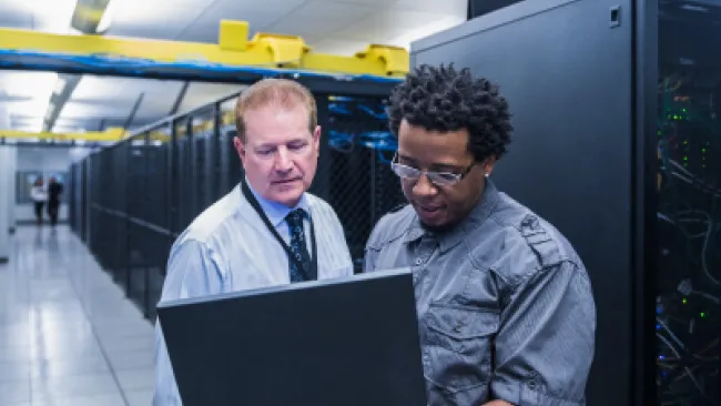 2 men analyzing some data