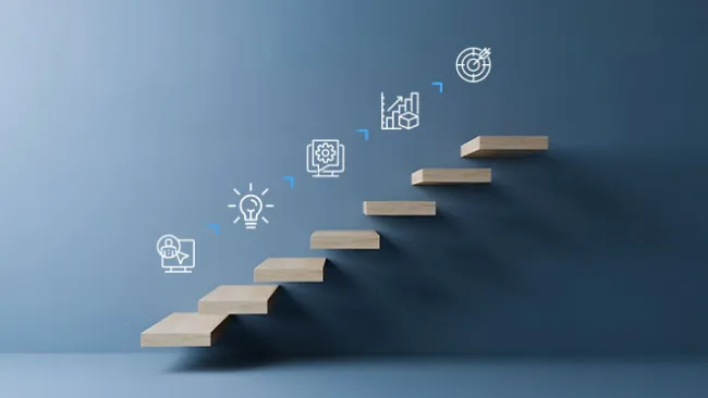 Stairs with icons above them denoting ideas/lightbulbs and sales/graphs images