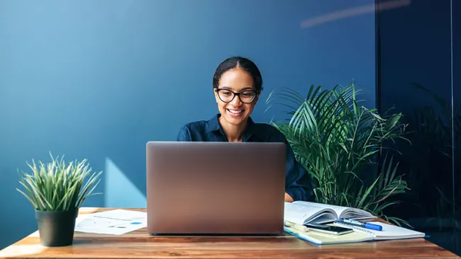 A woman who seems to be happy working at her station