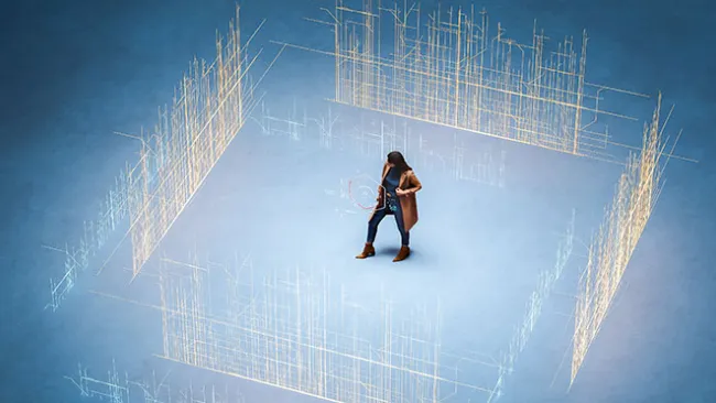 A person standing in the middle of digital walls