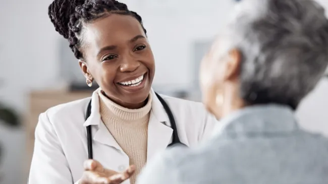 Doctor smiling at a patient