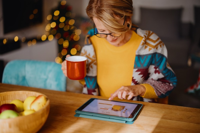 Woman shopping on her tablet during holiday time