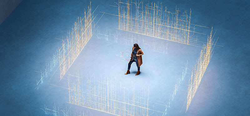 A person standing in the middle of digital walls