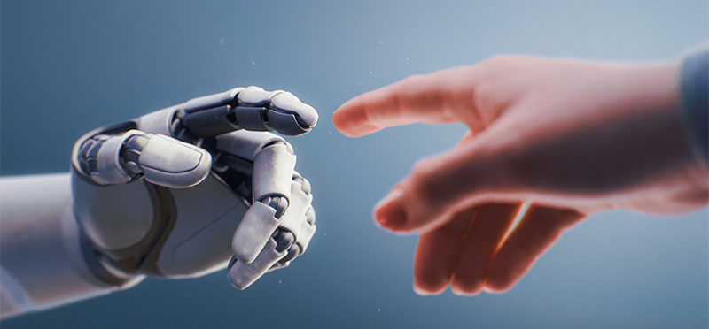 A human hand reaching out to touch a robot hand