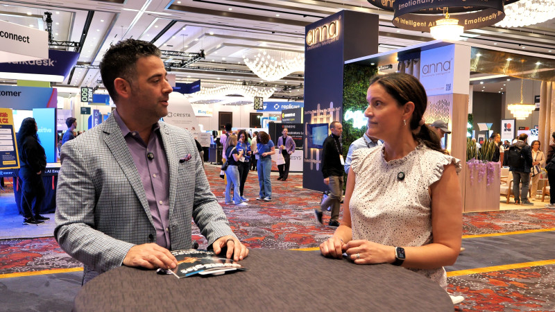 Two people talking in a conference hall 