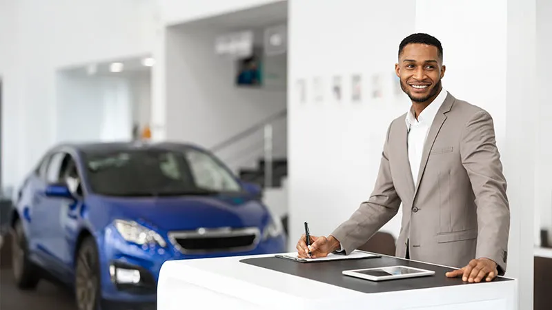 A salesman at a car dealership