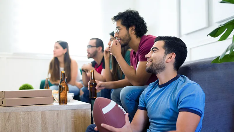 Peers watching a game at home